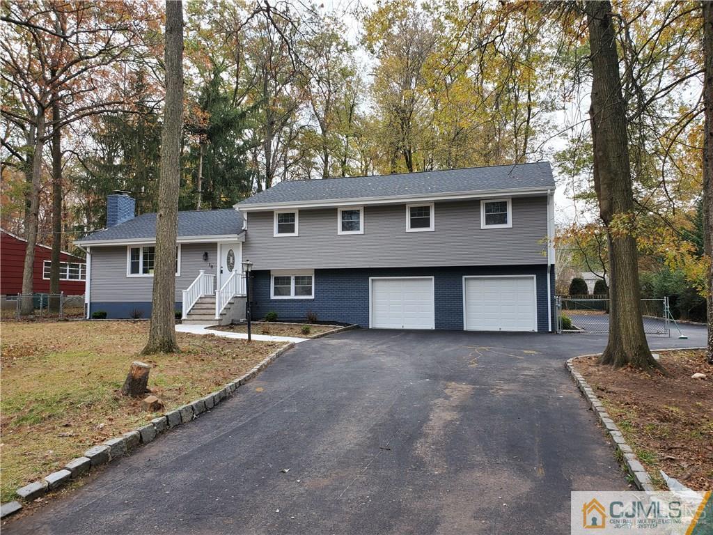 10 Huntington Road Edison, NJ 08820 - Photo 31 of 32 a front view of a house with a yard and garage
