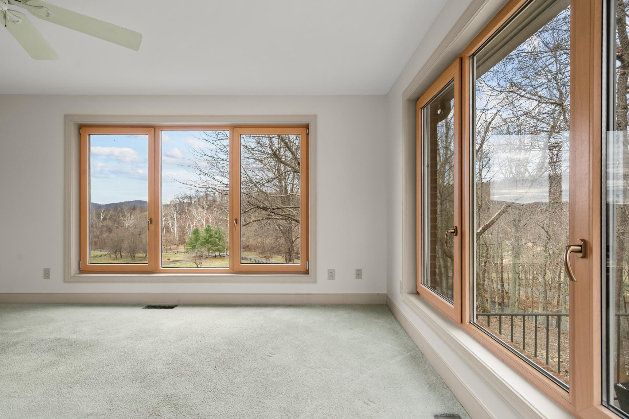 94 Old Hollow Road Sperryville, VA 22740 - Photo 13 of 38 a view of a room with large windows