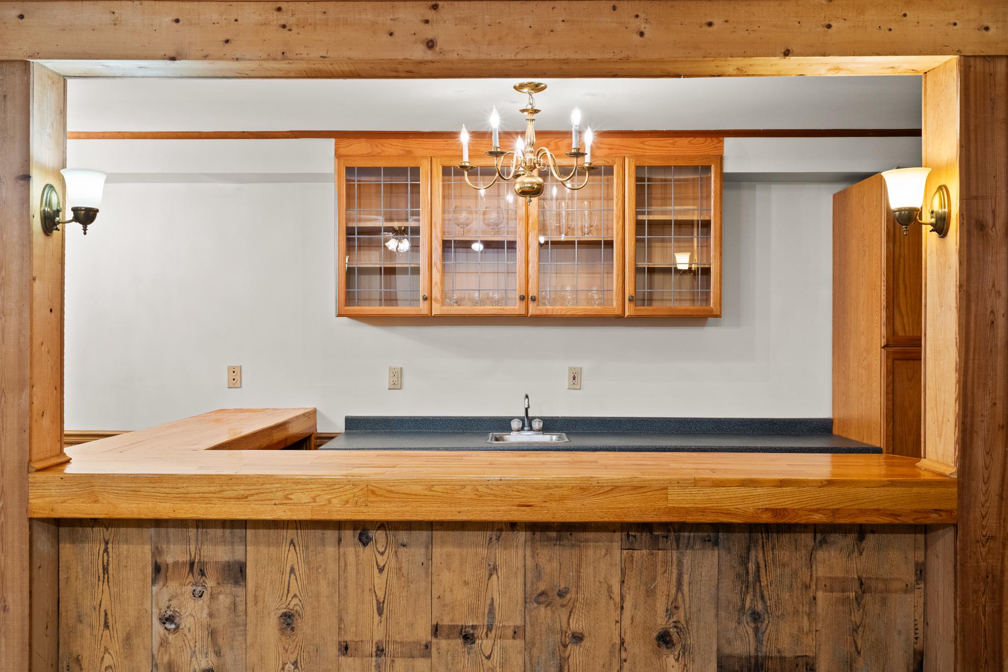 94 Old Hollow Road Sperryville, VA 22740 - Photo 18 of 38 a bathroom with a granite countertop sink and a mirror