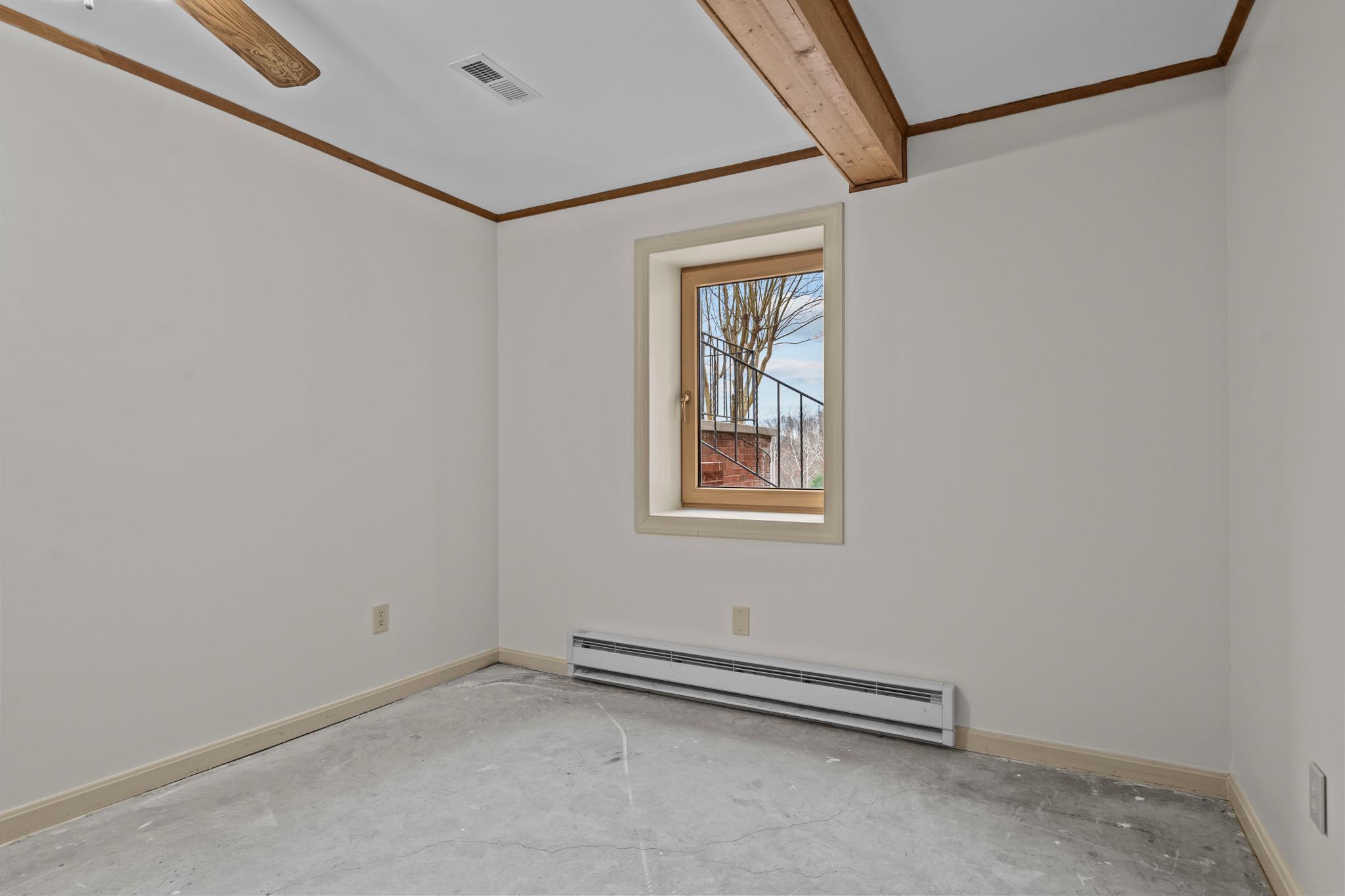 94 Old Hollow Road Sperryville, VA 22740 - Photo 21 of 38 a view of a room with rack on the wall and a window