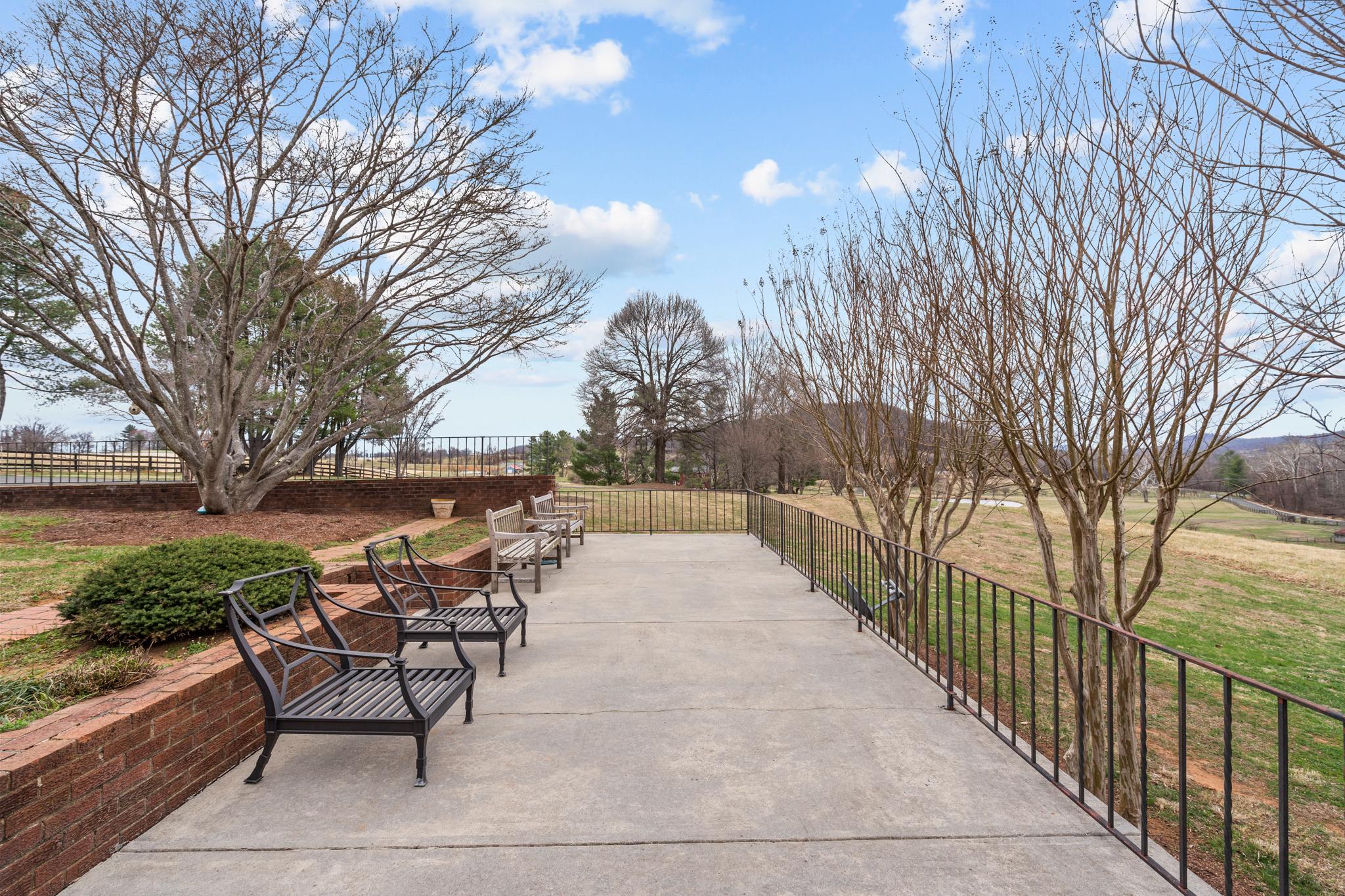 94 Old Hollow Road Sperryville, VA 22740 - Photo 28 of 38 a view of a patio with table and chairs and wooden fence