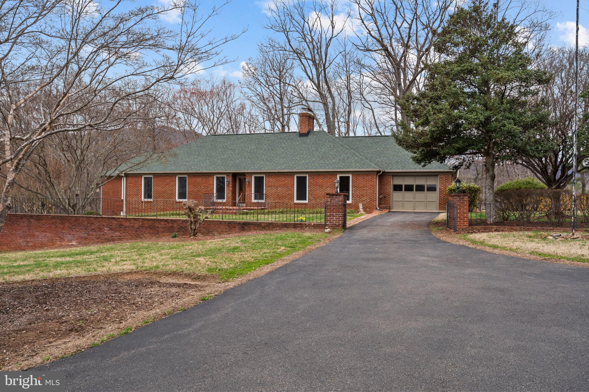 94 Old Hollow Road Sperryville, VA 22740 - Photo 36 of 38 front view of a house with a yard