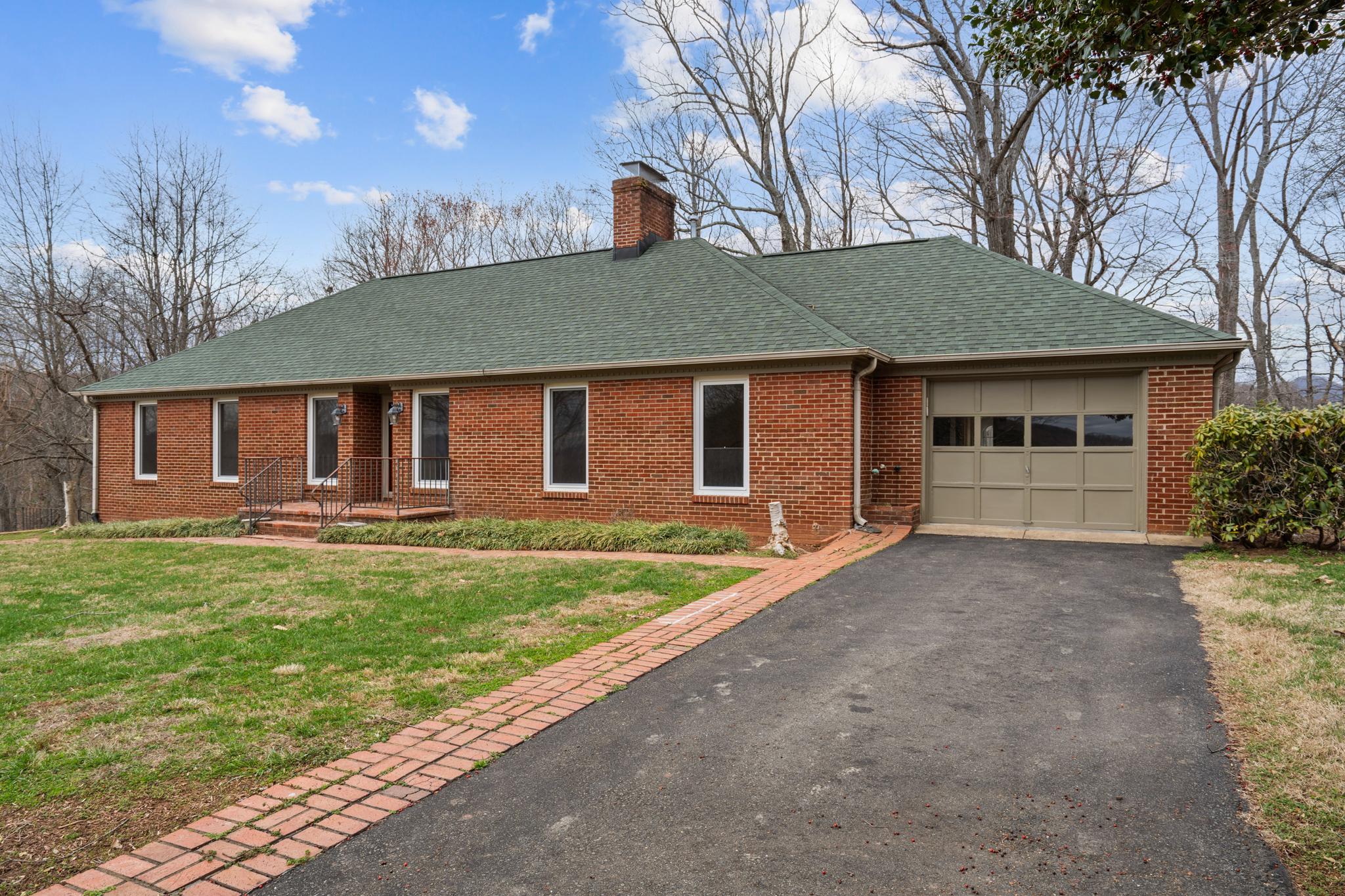 94 Old Hollow Road Sperryville, VA 22740 - Photo 37 of 38 a front view of a house with a garden