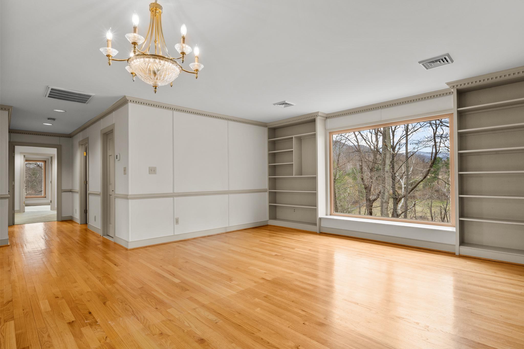 94 Old Hollow Road Sperryville, VA 22740 - Photo 6 of 38 a view of a livingroom with wooden floor and a large window