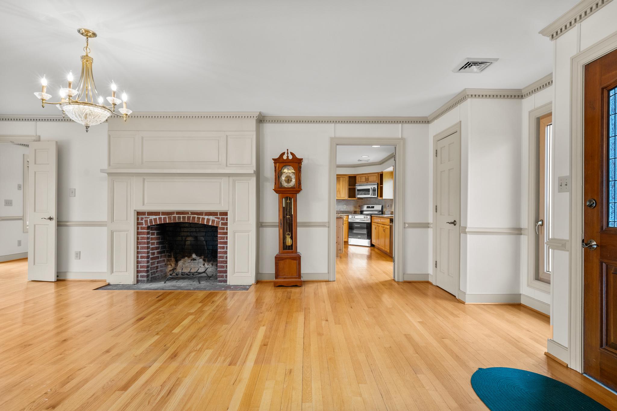 94 Old Hollow Road Sperryville, VA 22740 - Photo 7 of 38 a view of a livingroom with wooden floor and a fireplace
