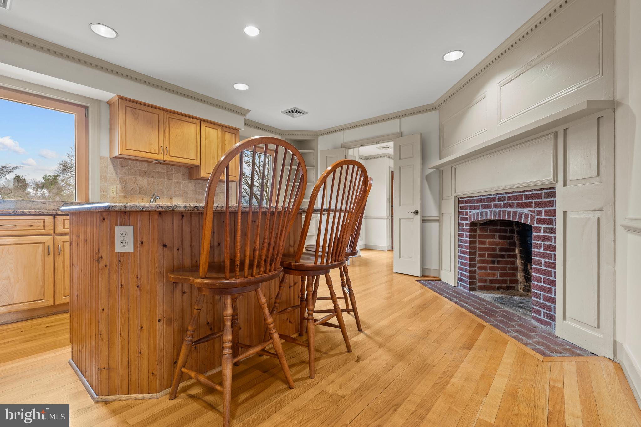 94 Old Hollow Road Sperryville, VA 22740 - Photo 9 of 38 a view of a livingroom with furniture wooden floor and a fireplace