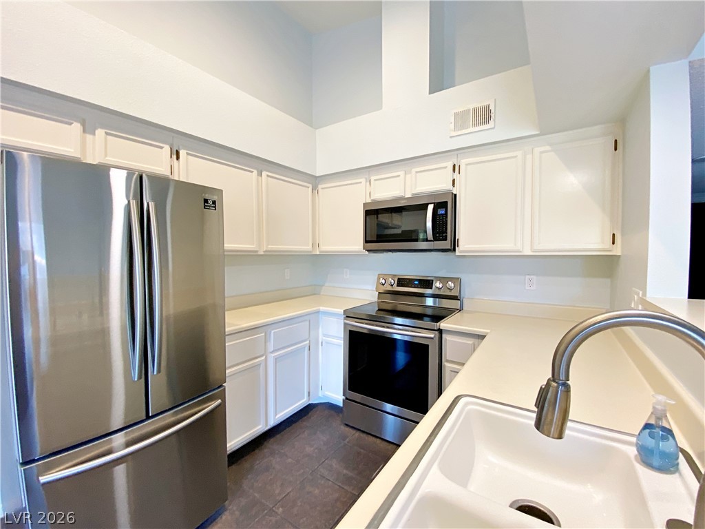 1575 West Warm Springs Road, Unit 1024 Henderson, NV 89014 - Photo 19 of 25 A well-equipped culinary space boasts stainless steel appliances and abundant cabinetry for storage.