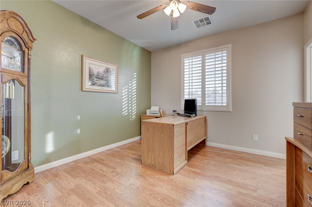 1604 Cattle Ranch Place Henderson, NV 89002 - Photo 54 of 99 A quiet and adaptable space with a ceiling fan, perfect for a home office or study.