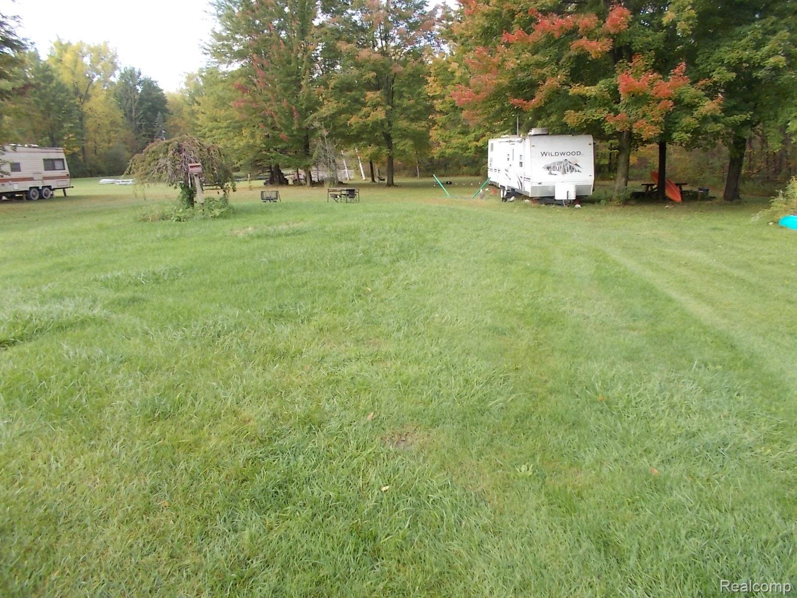 3130 Cat Lake Road Caro, MI 48723 - Photo 10 of 11 Expansive grassy terrain with mature trees