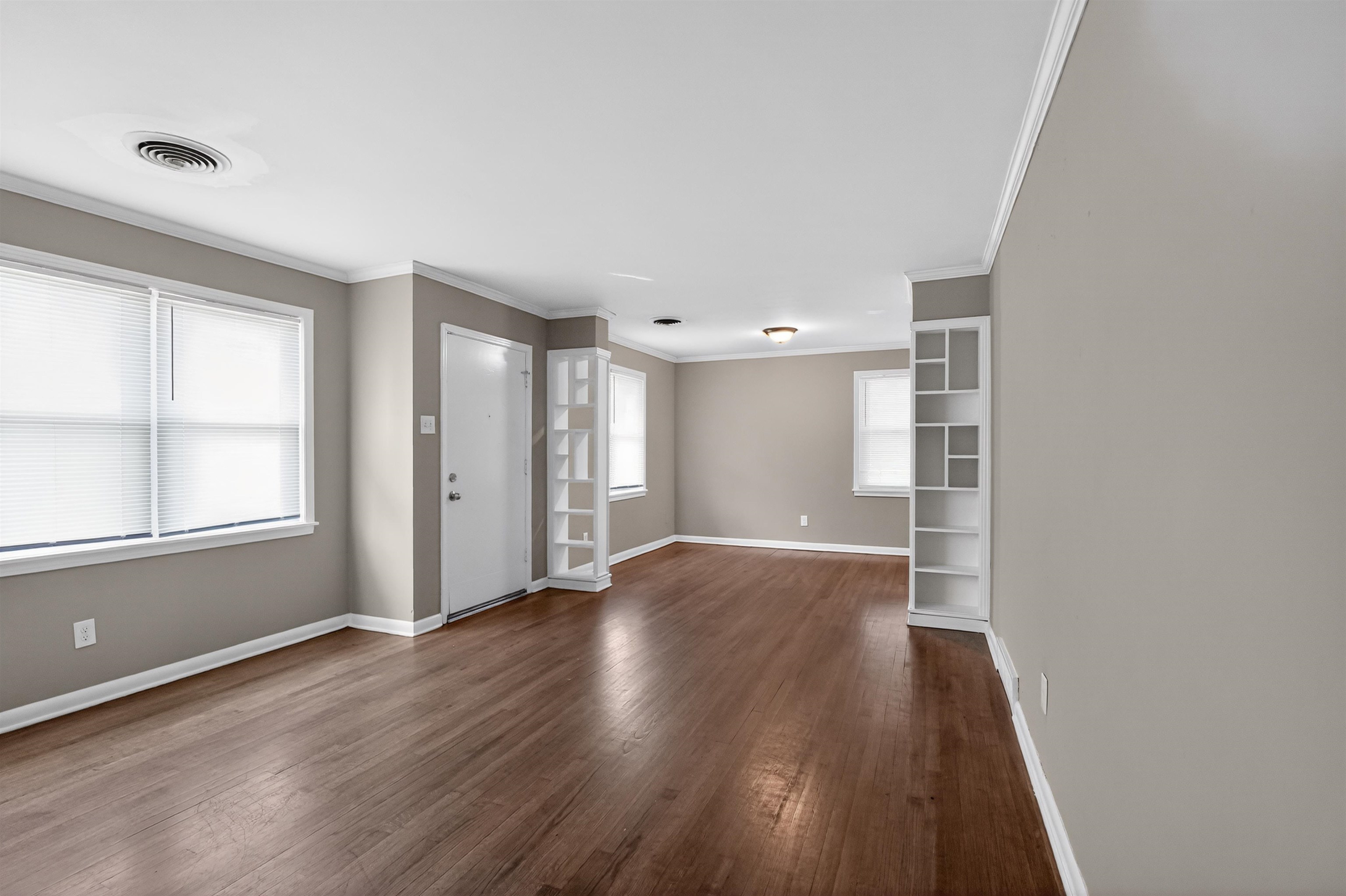 1514 Mt Moriah Road Memphis, TN 38117 - Photo 13 of 34 Spacious interior featuring wood-finish flooring, neutral wall tones, and white trim