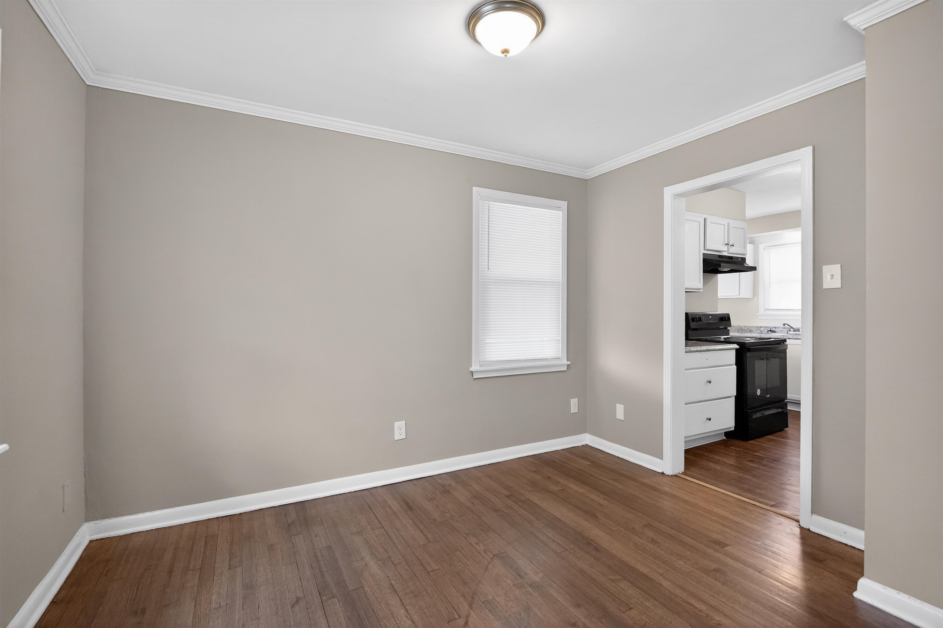 1514 Mt Moriah Road Memphis, TN 38117 - Photo 20 of 34 Wood-finish flooring throughout, complemented by crown molding and baseboards