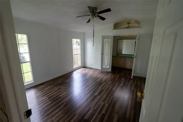 a view of livingroom with hardwood floor and a ceiling fan