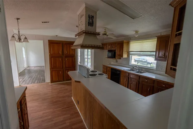 a kitchen with stainless steel appliances a sink stove and refrigerator