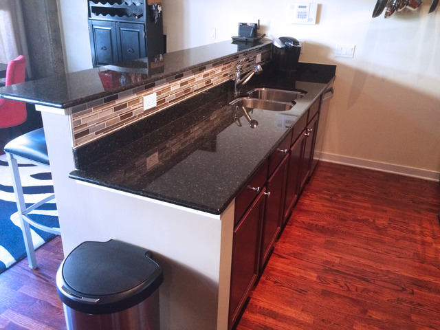 1111 West 15th Street, Unit 126 Chicago, IL 60608 - Photo 13 of 24 a kitchen with sink and stove