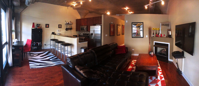 1111 West 15th Street, Unit 126 Chicago, IL 60608 - Photo 3 of 24 a living room with furniture and a flat screen tv