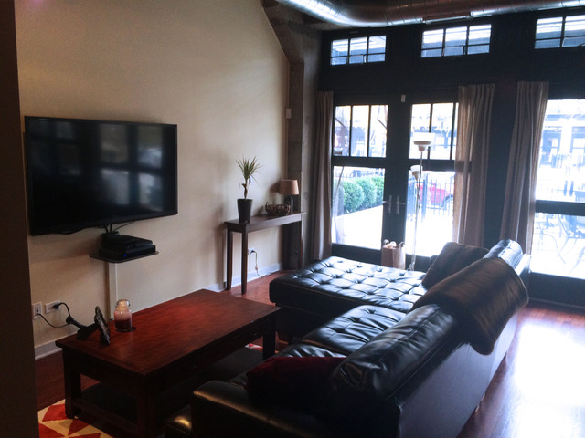 1111 West 15th Street, Unit 126 Chicago, IL 60608 - Photo 7 of 24 a bedroom with furniture and a window