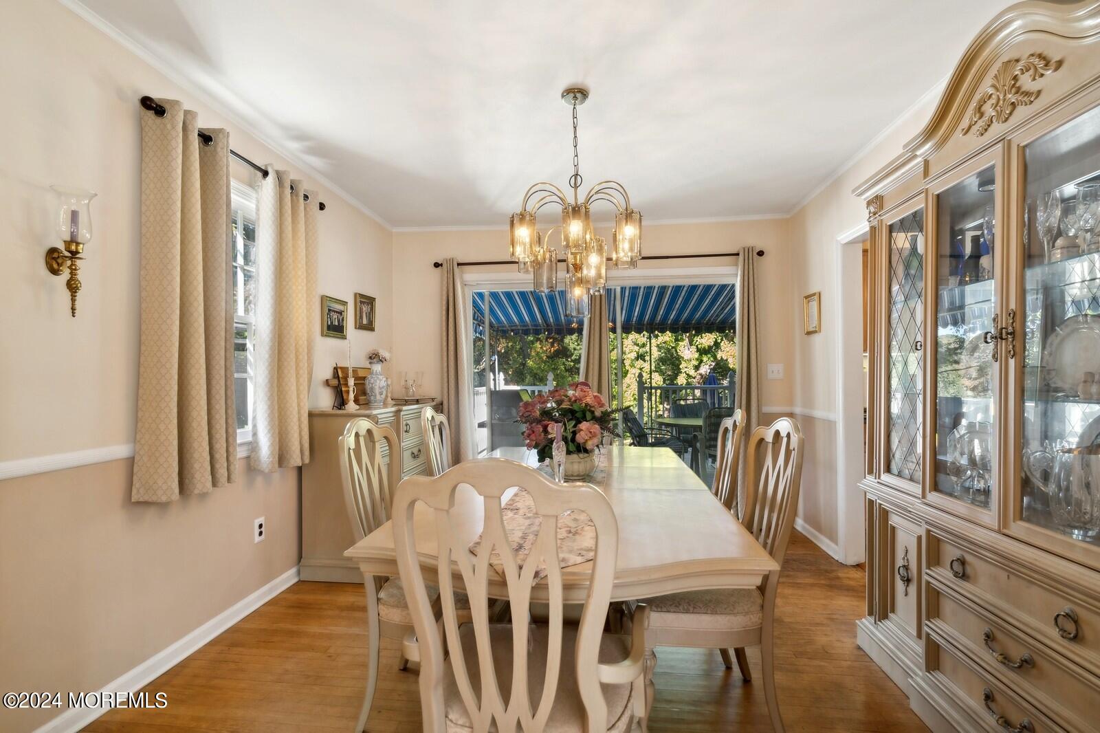 57 Pelican Road Middletown, NJ 07748 - Photo 16 of 49 a view of a dining room with furniture window and wooden floor