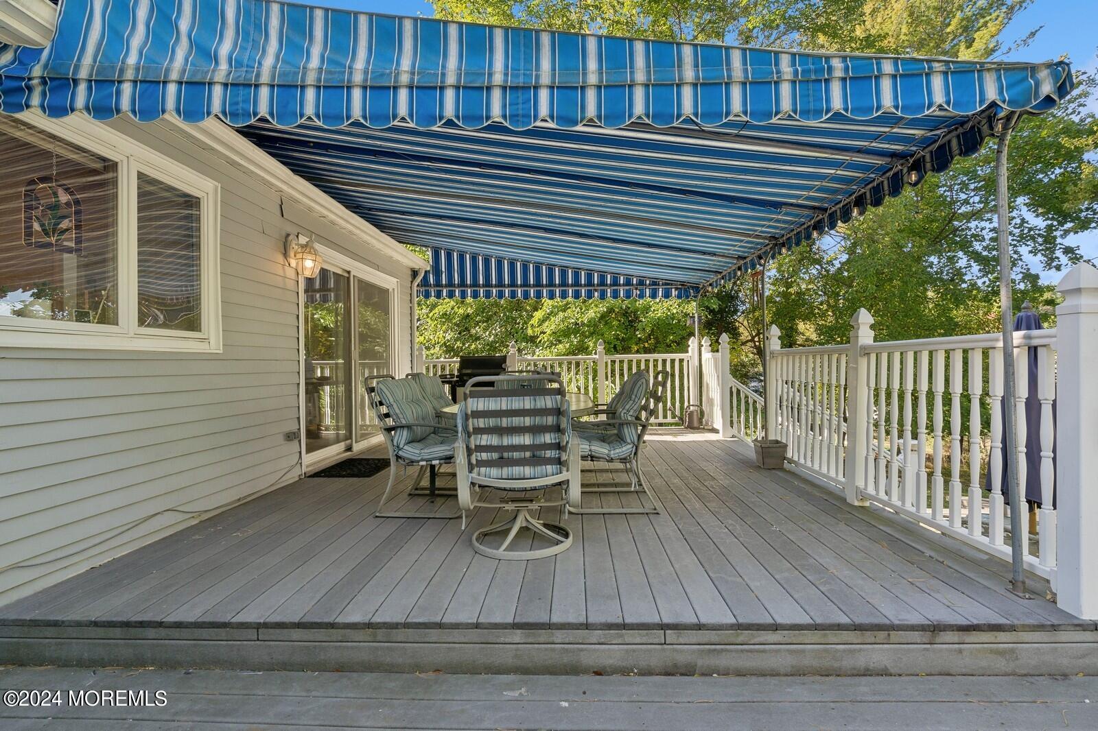 57 Pelican Road Middletown, NJ 07748 - Photo 26 of 49 a view of a chairs and table on the deck