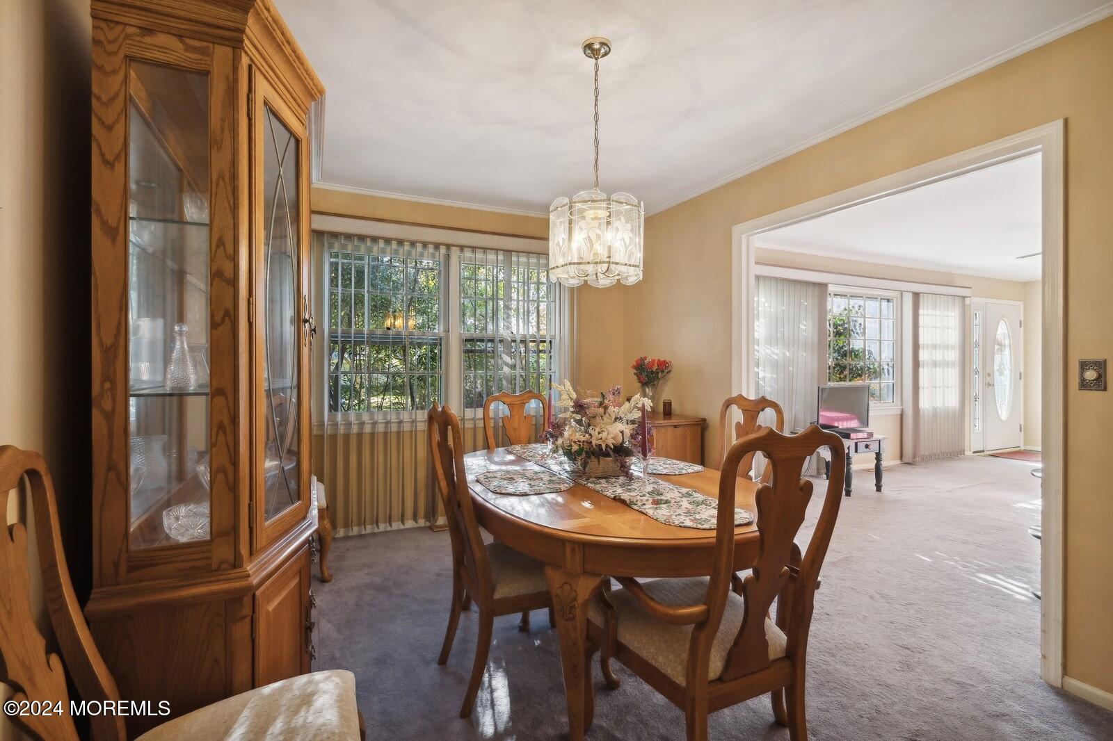 57 Pelican Road Middletown, NJ 07748 - Photo 29 of 49 a view of a dining room with furniture window and outside view