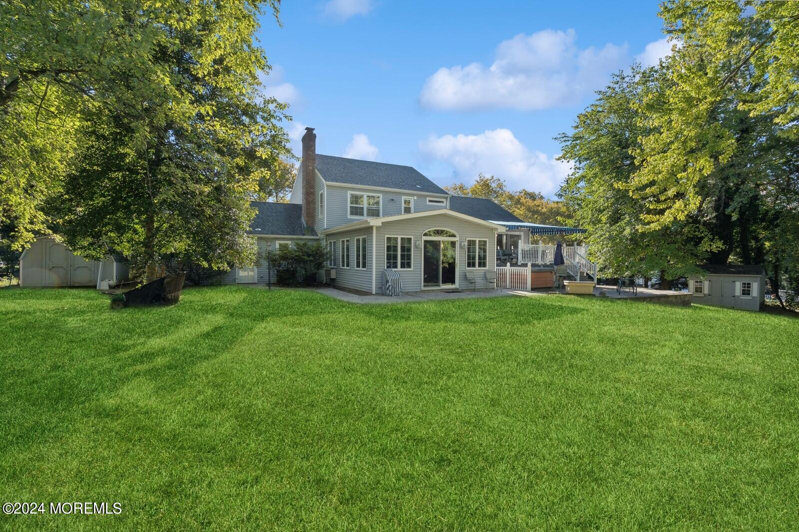 57 Pelican Road Middletown, NJ 07748 - Photo 36 of 49 a view of house that has a yard