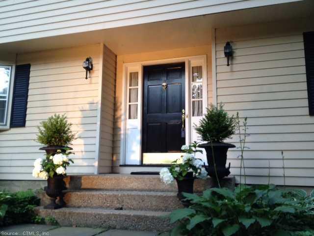 2 Deer Run Road Canton, CT 06019 - Photo 1 of 1 a front view of a house with a yard