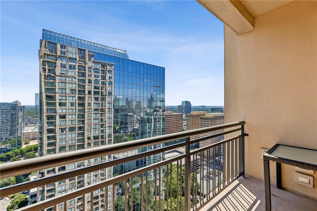 3445 Stratford Road Northeast, Unit 3105 Atlanta, GA 30326 - Photo 28 of 47 a view of balcony with a couple of cars parked in parking lot