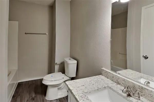 a bathroom with a toilet and a sink