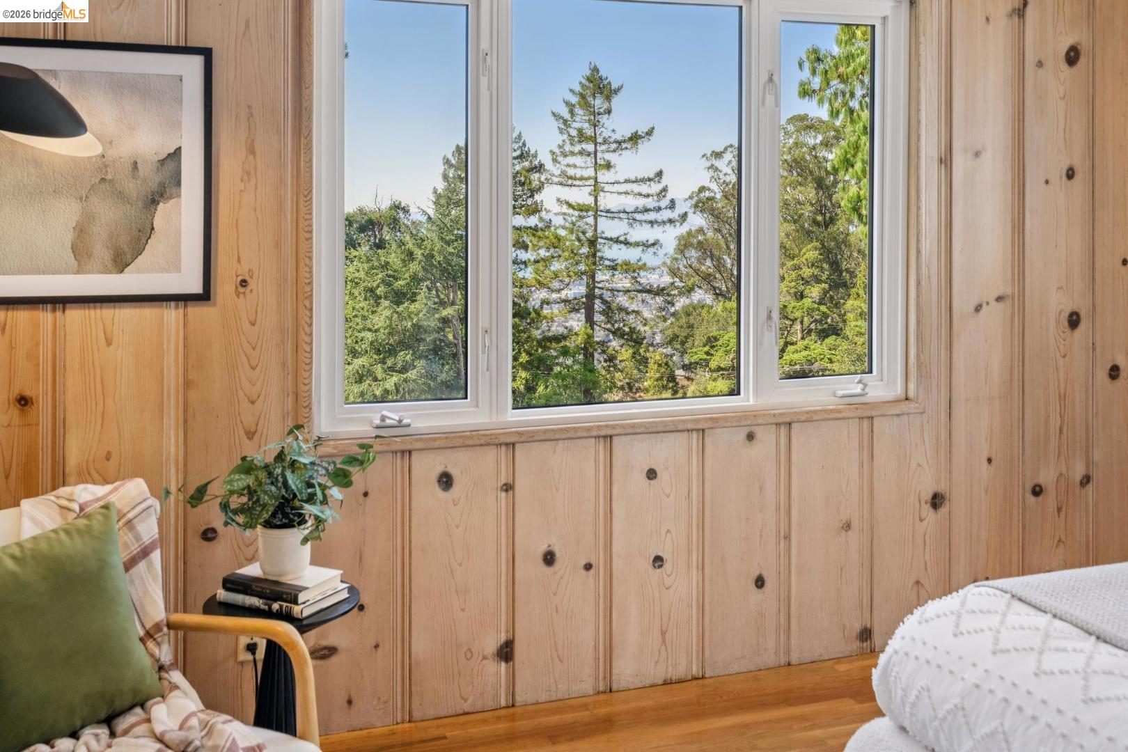 155 Avenida Drive Berkeley, CA 94708 - Photo 41 of 86 Wood-paneled walls with natural knot details, large multi-pane windows, and wood-finish flooring