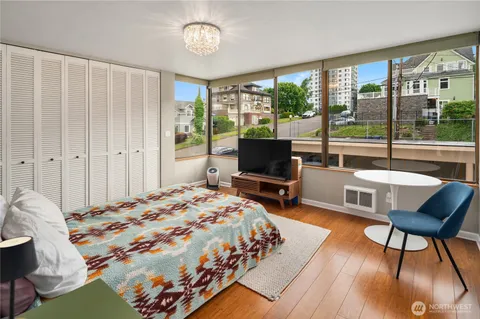 a bedroom with a bed and a dresser