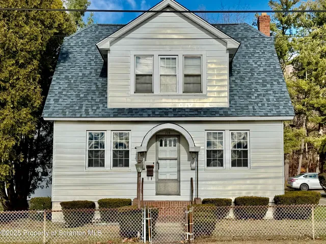a front view of a house with a balcony