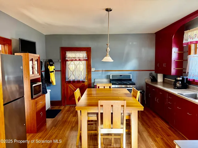 a dining room with furniture and window