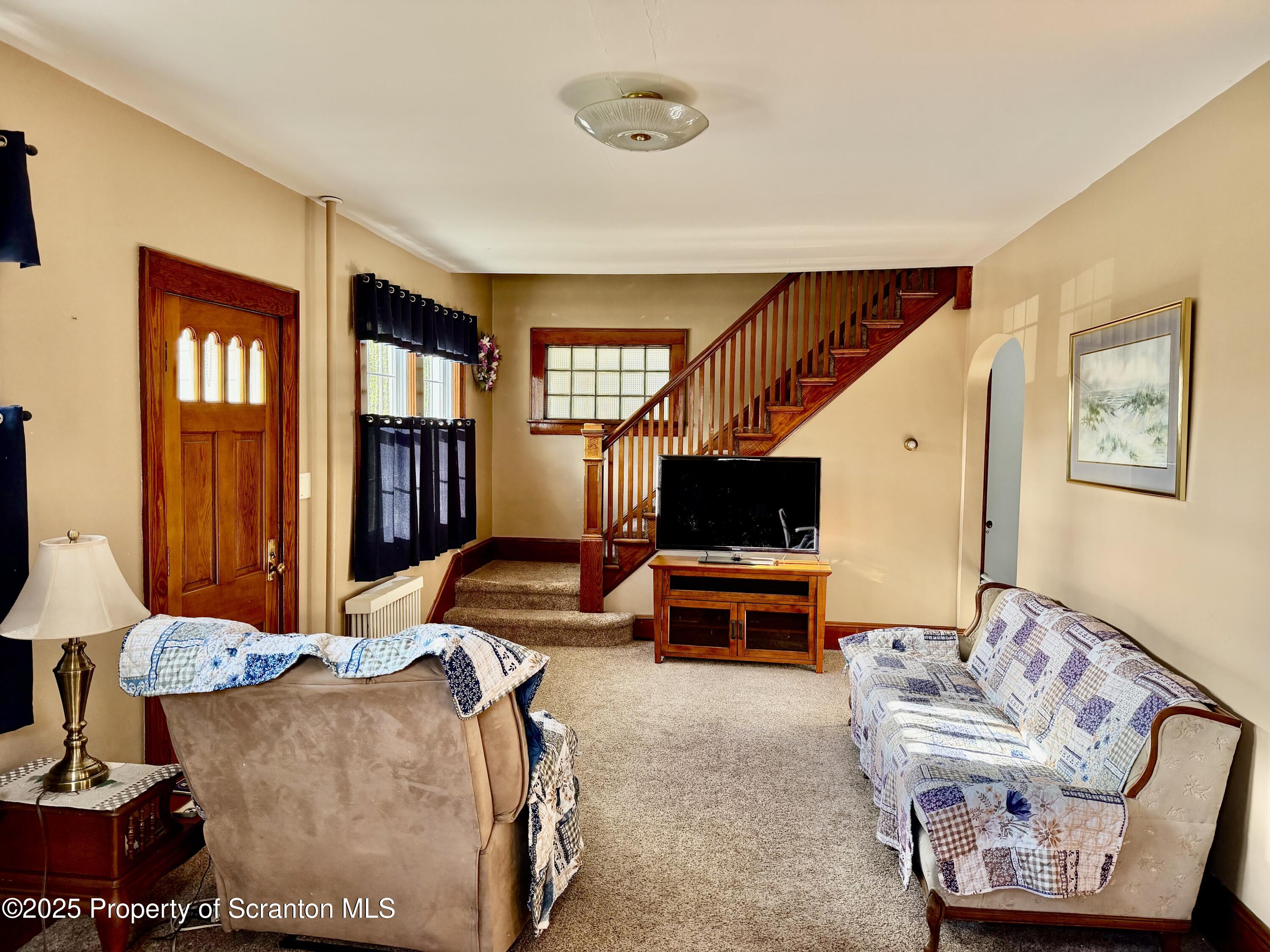 116 South Main Street Archbald, PA 18403 - Photo 17 of 31 a living room with furniture and a flat screen tv