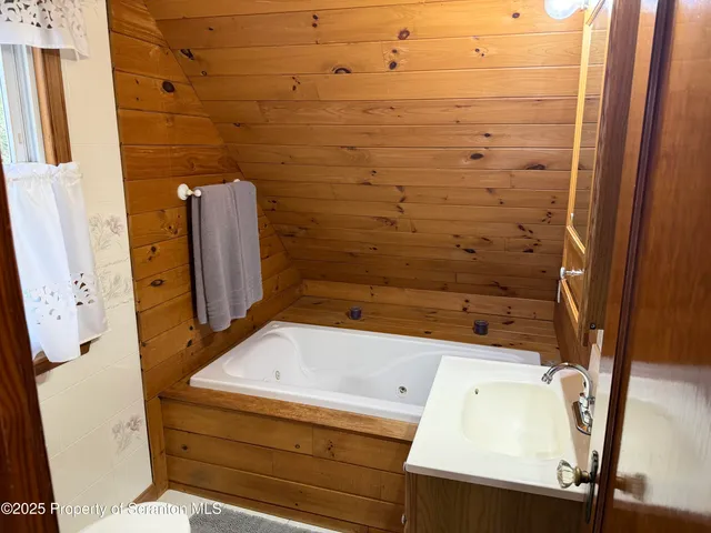 a bedroom with bed and window