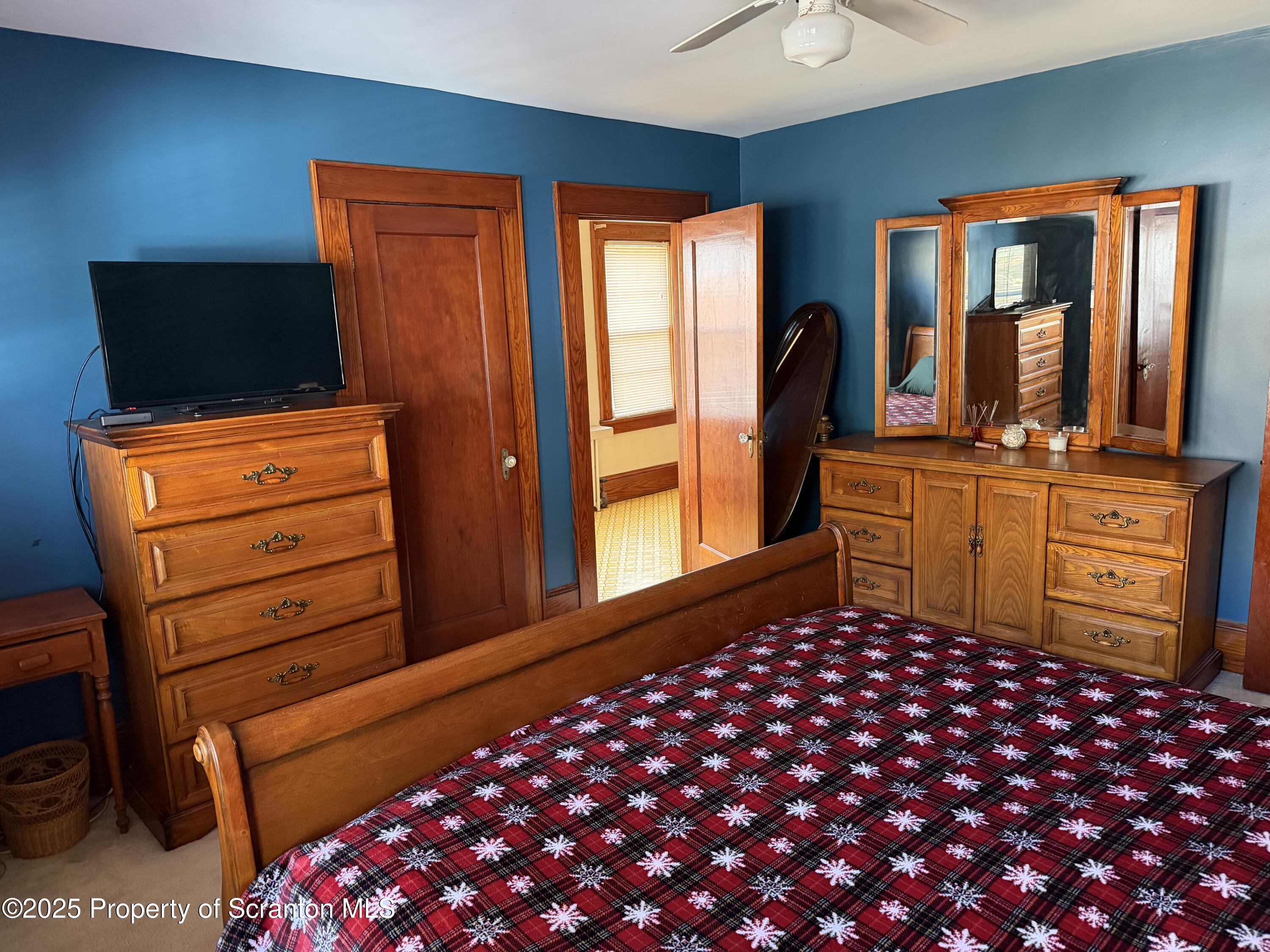 116 South Main Street Archbald, PA 18403 - Photo 23 of 31 a bedroom with a bed and wooden floor