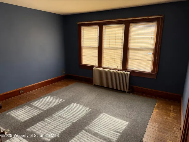 a bedroom with furniture and chandelier