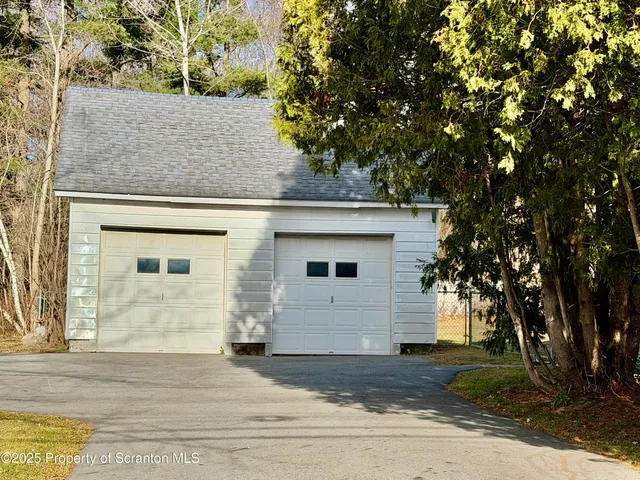 a view of a house with a tree
