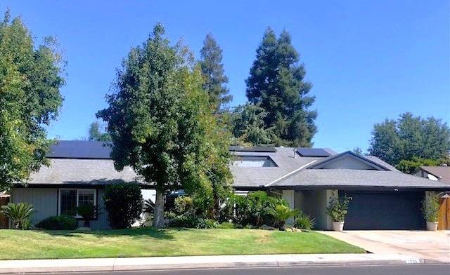 1955 Alamos Avenue Clovis, CA 93611 - Photo 1 of 28 a front view of a house with a yard