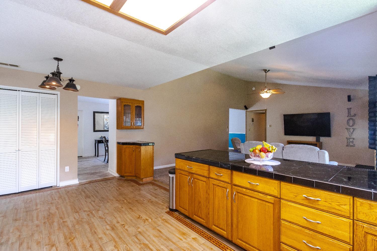 1955 Alamos Avenue Clovis, CA 93611 - Photo 11 of 28 a kitchen with a sink and wooden floor