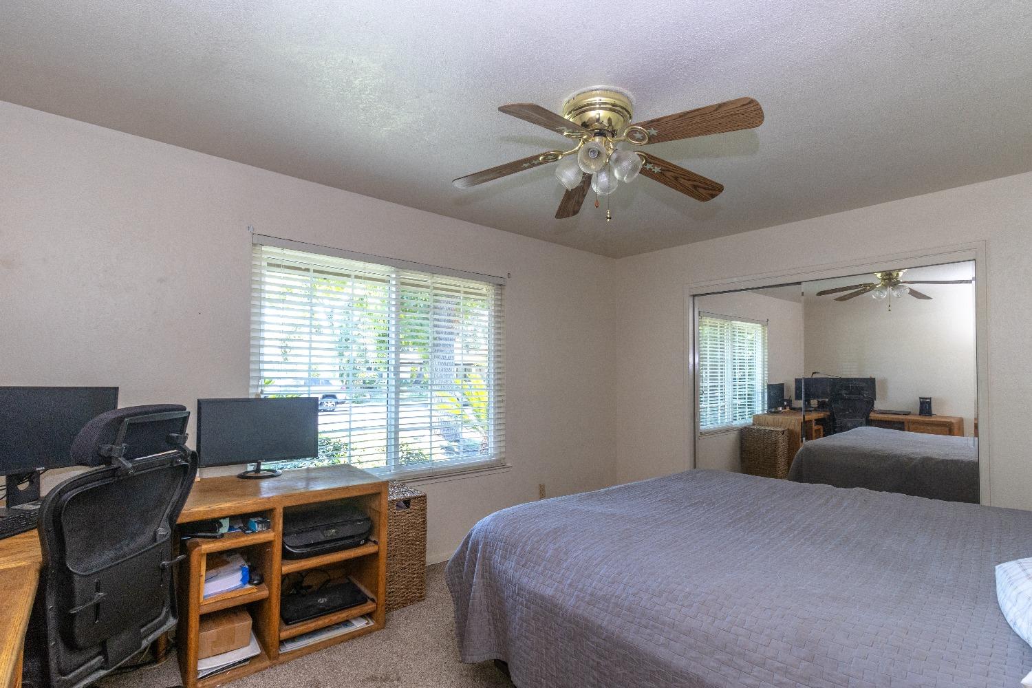 1955 Alamos Avenue Clovis, CA 93611 - Photo 17 of 28 a bedroom with a bed and a window