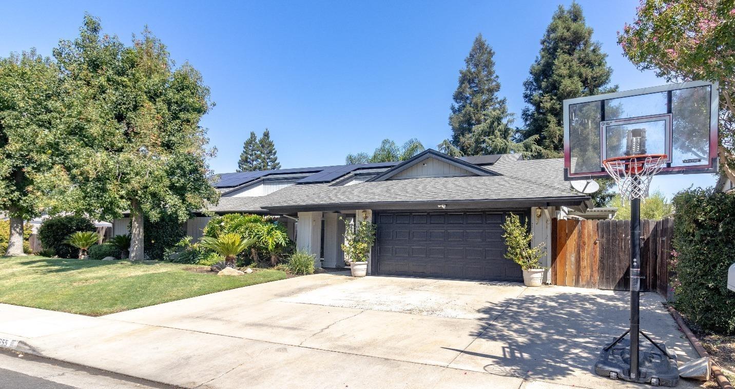 1955 Alamos Avenue Clovis, CA 93611 - Photo 2 of 28 a front view of a house with a yard
