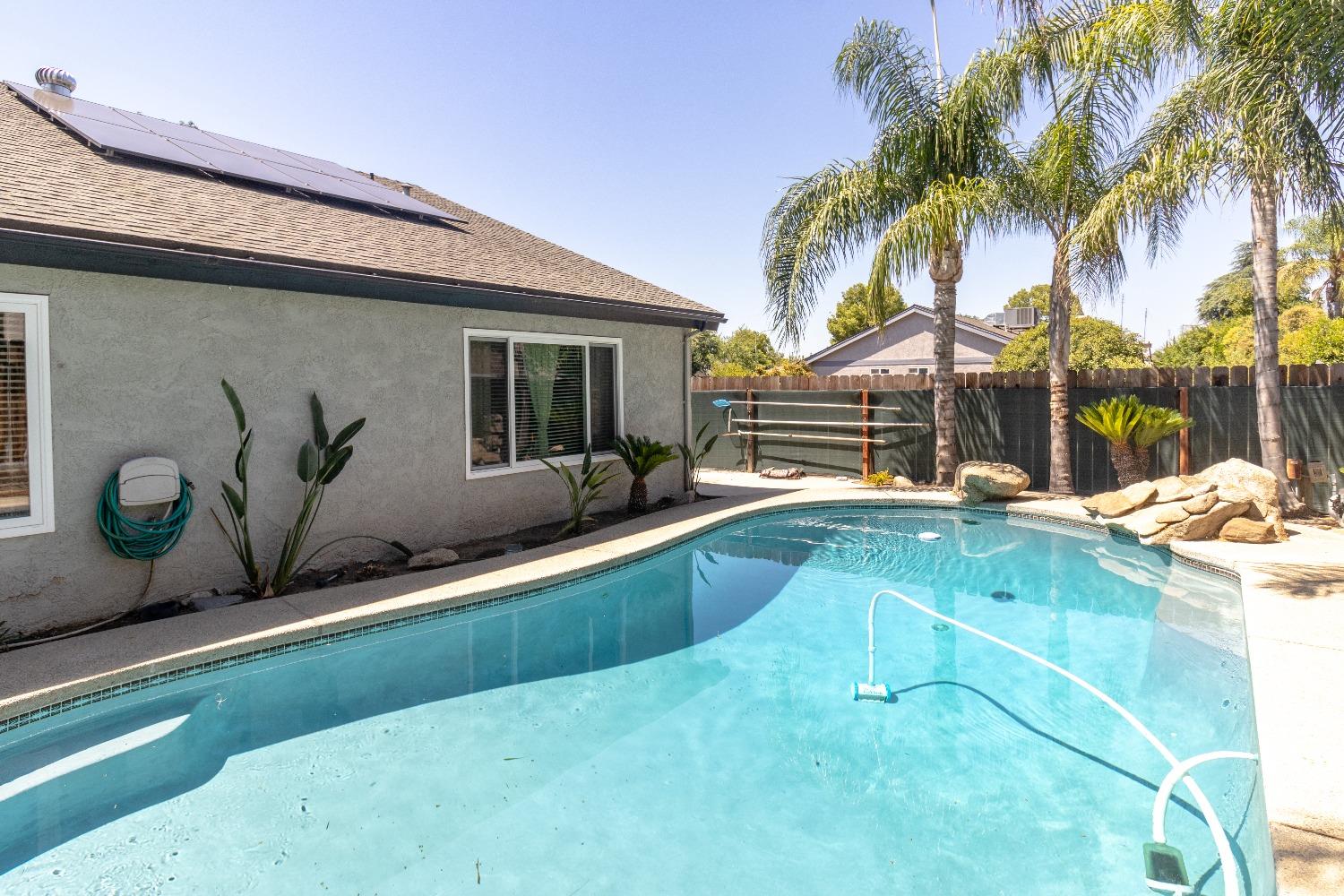 1955 Alamos Avenue Clovis, CA 93611 - Photo 25 of 28 a view of a backyard with potted plants