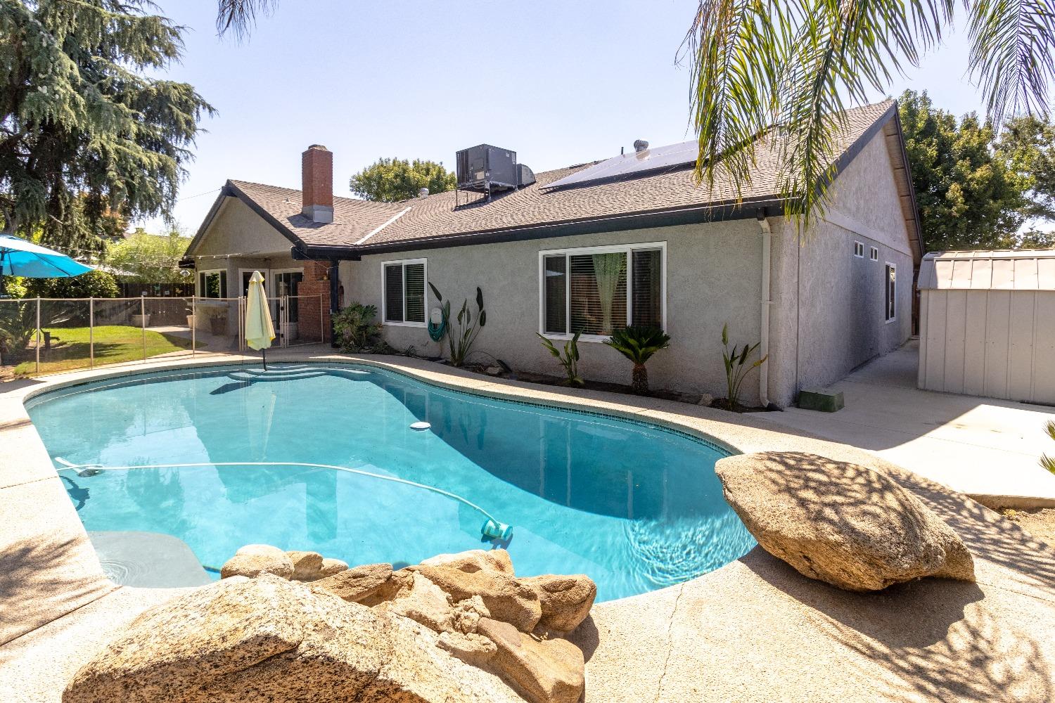 1955 Alamos Avenue Clovis, CA 93611 - Photo 27 of 28 a swimming pool view with a outdoor seating