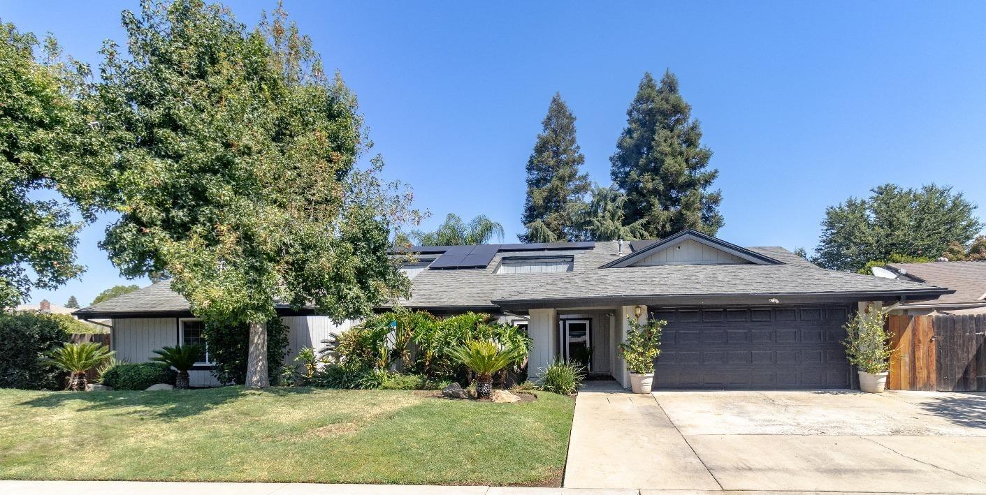 1955 Alamos Avenue Clovis, CA 93611 - Photo 28 of 28 a front view of a house with a garden