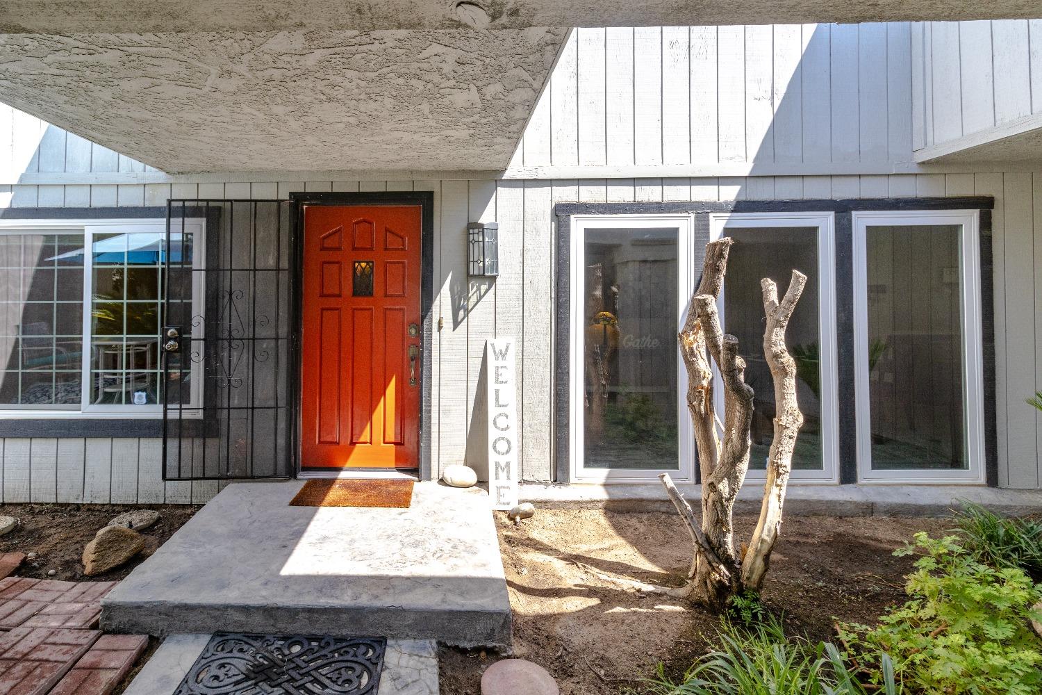 1955 Alamos Avenue Clovis, CA 93611 - Photo 3 of 28 a front view of a house with a porch
