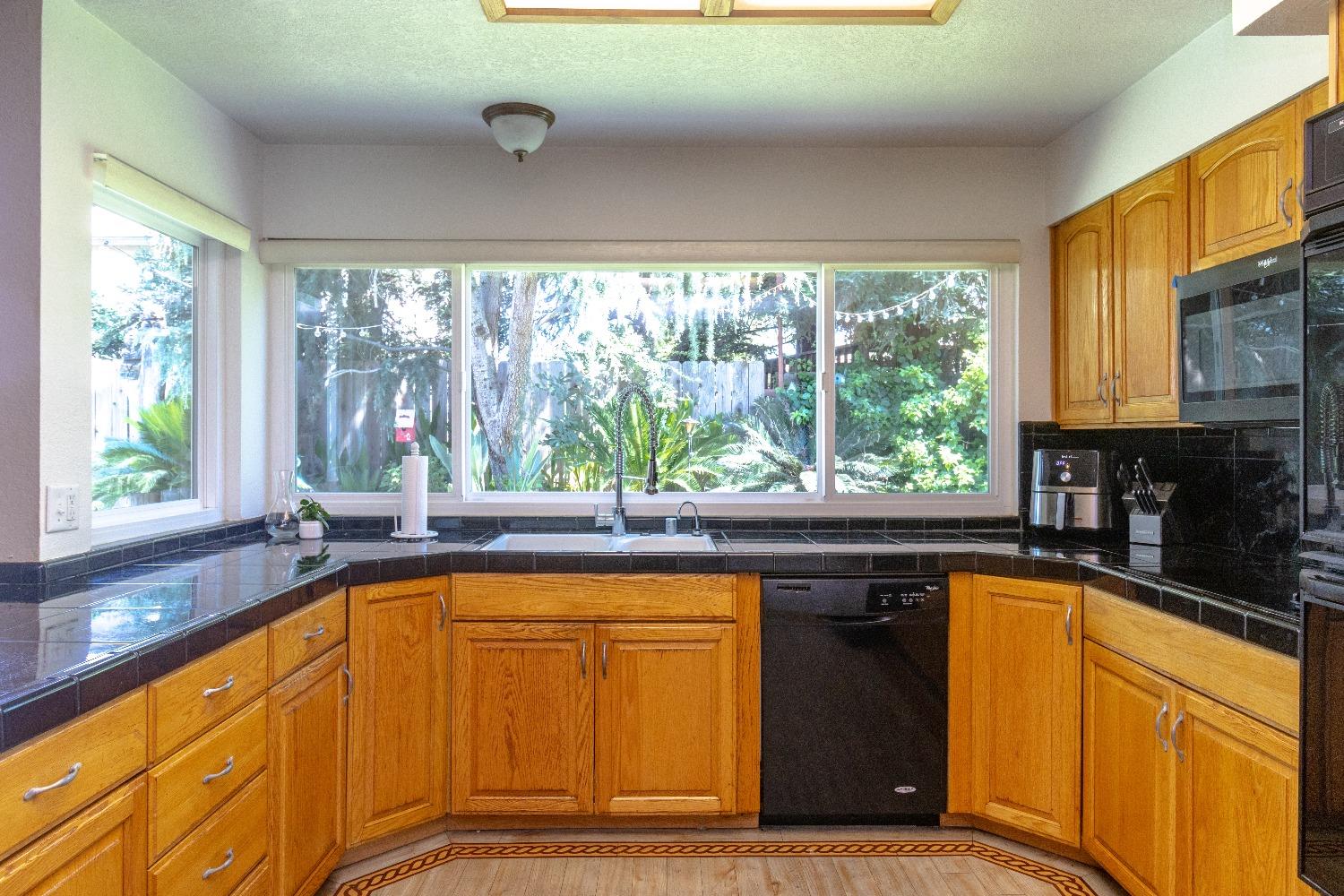 1955 Alamos Avenue Clovis, CA 93611 - Photo 10 of 28 a view of a kitchen with a sink and large window