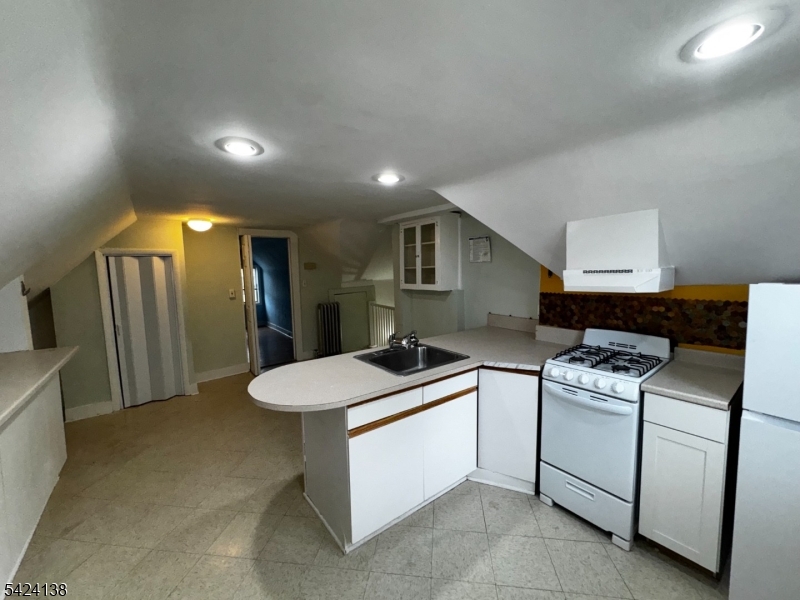 160 Chestnut Street, Unit 2 Montclair, NJ 07042 - Photo 16 of 20 a kitchen that has a sink and a stove in it