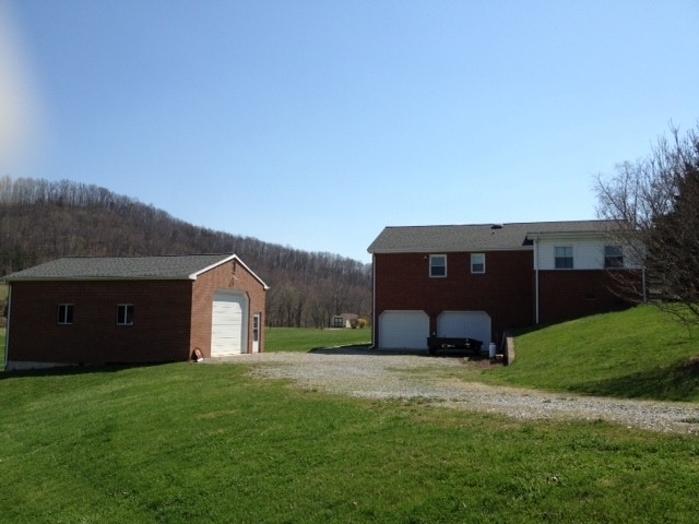 52 Arch Mill Road Fincastle, VA 24090 - Photo 2 of 42 Detached Garage and Rear View of Home