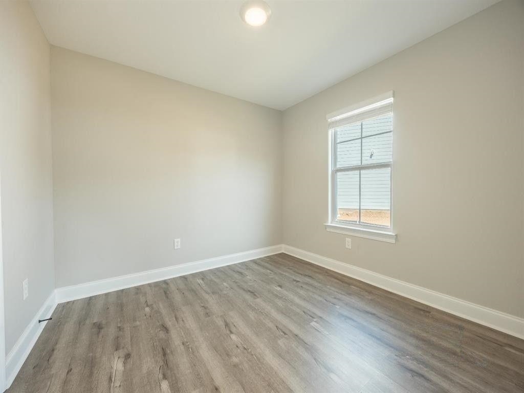 23906 Peppermint Street Elberta, AL 36530 - Photo 13 of 14 Empty room with baseboards and light wood finished floors