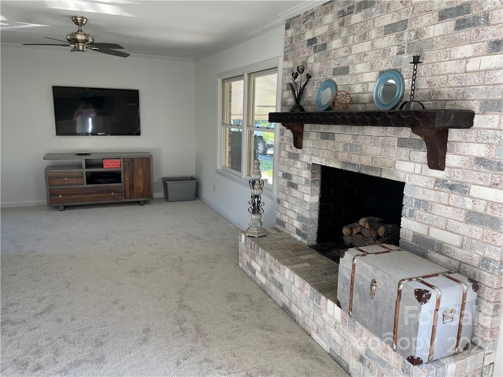 3616 Morgan Mill Road Monroe, NC 28110 - Photo 4 of 19 a living room with furniture and a fireplace