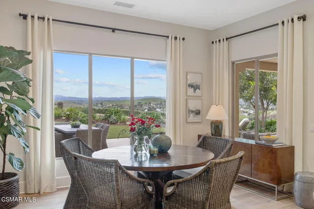 a living room with furniture fireplace and flat screen tv